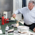 David Blume demonstrates how clean fuel burns at Blume Distillation Calabasas Road in Watsonville. — photo by Juan Martinez file